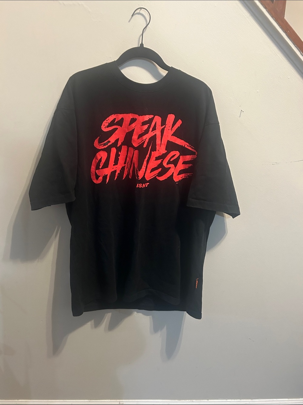 Black Short-Sleeve Graphic Tee with Red 'SPEAK CHINESE' Script